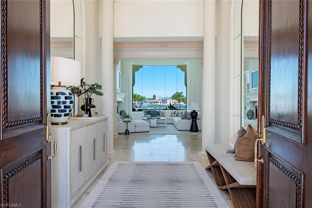 13741 Pondview Circle Naples, FL 34119 - Photo 2 of 50 a living room with furniture and a flat screen tv