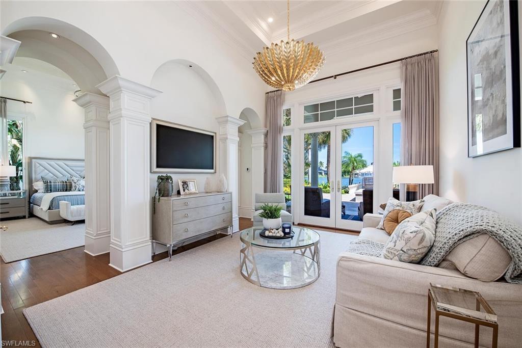 13741 Pondview Circle Naples, FL 34119 - Photo 22 of 50 a living room with furniture and a flat screen tv