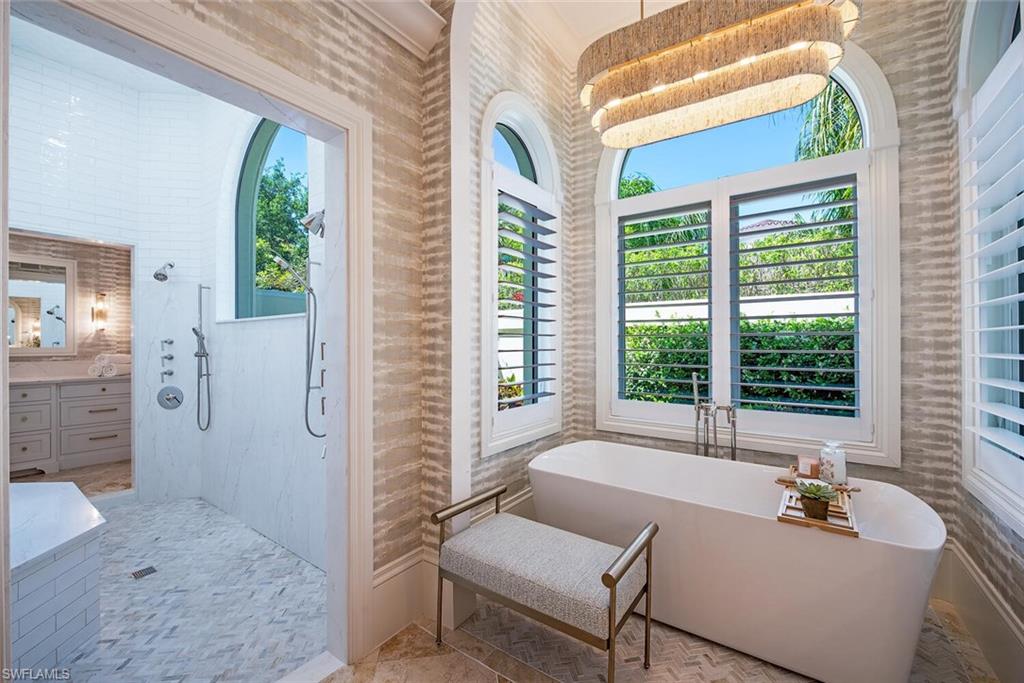 13741 Pondview Circle Naples, FL 34119 - Photo 25 of 50 a living room with furniture and a large window