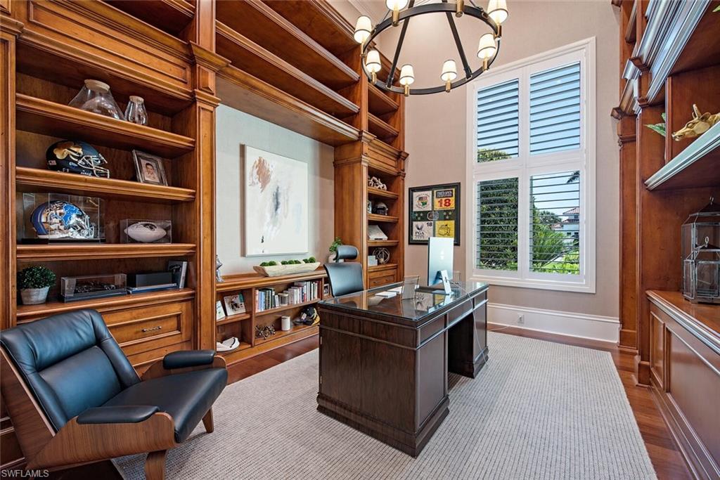 13741 Pondview Circle Naples, FL 34119 - Photo 29 of 50 a reading room with furniture window and book shelf