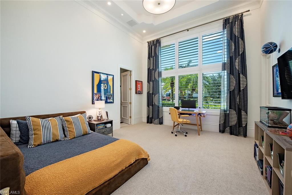 13741 Pondview Circle Naples, FL 34119 - Photo 32 of 50 a bedroom with furniture and a large window