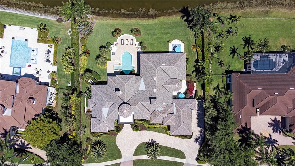13741 Pondview Circle Naples, FL 34119 - Photo 39 of 50 an aerial view of a house with a garden and yard