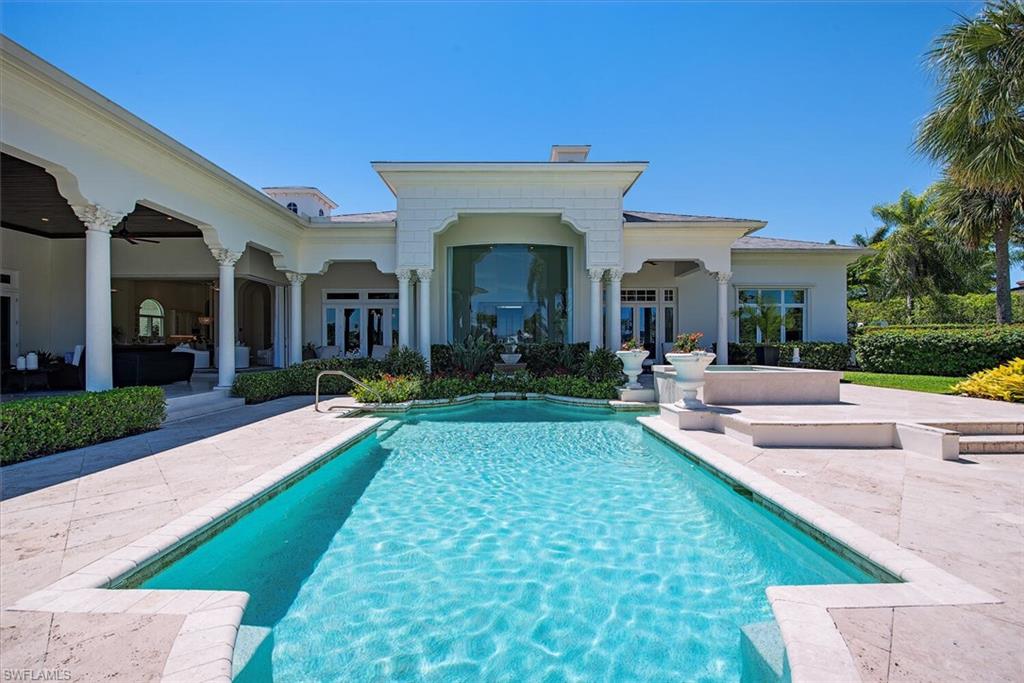 13741 Pondview Circle Naples, FL 34119 - Photo 8 of 50 a view of a house with swimming pool and sitting area