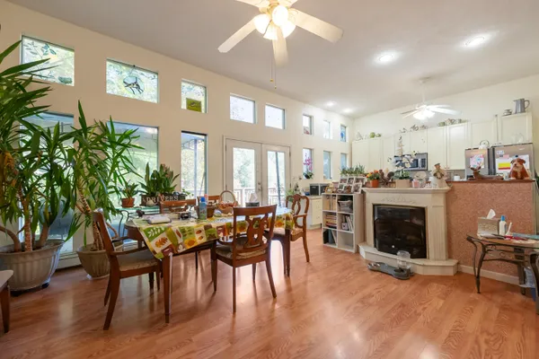 a view of a dining room with furniture window and wooden floor