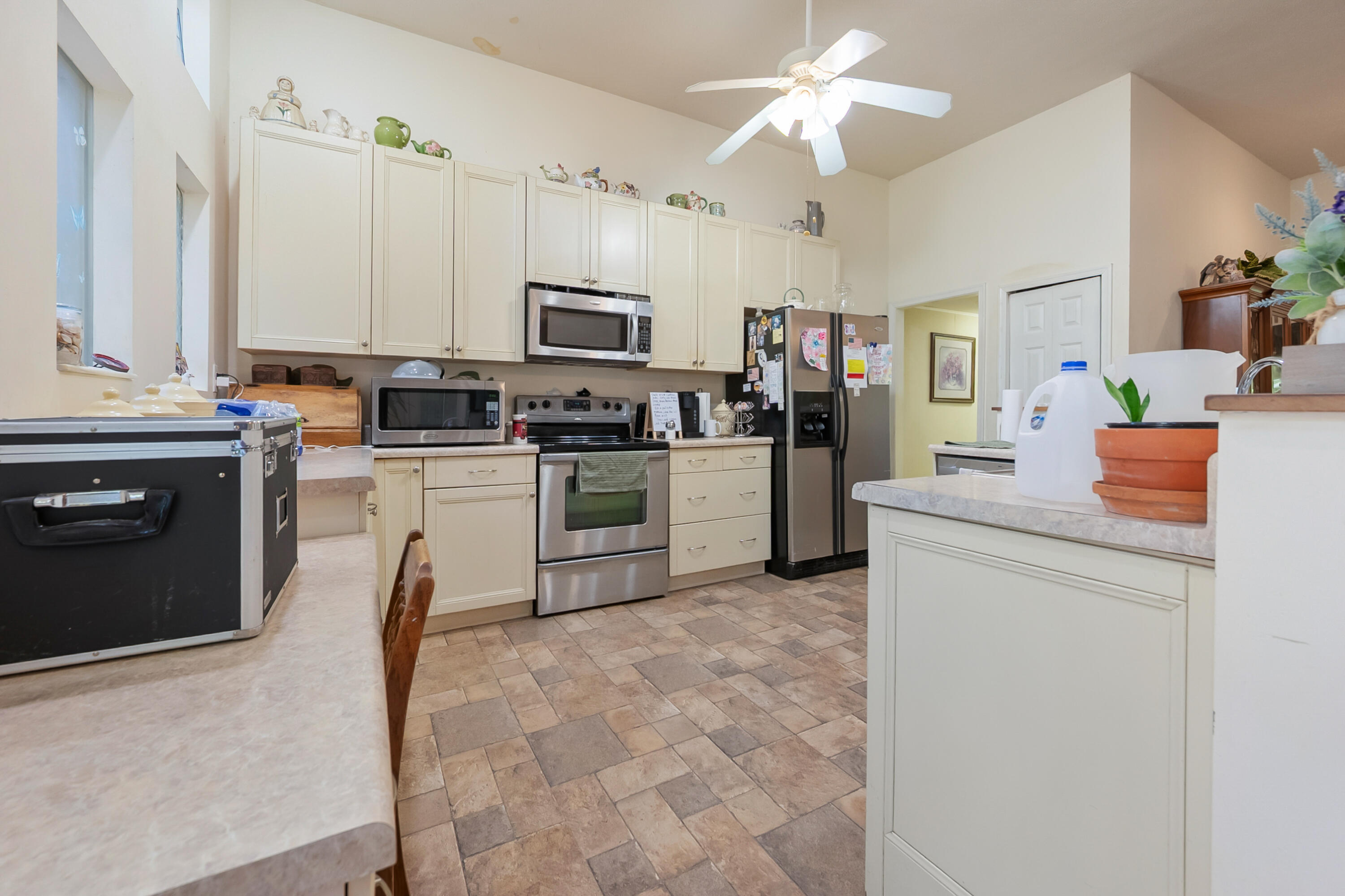 6286 Chestnut Ridge Road Riner, VA 24149 - Photo 16 of 102 a kitchen with stainless steel appliances granite countertop a stove top oven a sink dishwasher a refrigerator and a fireplace with wooden floor