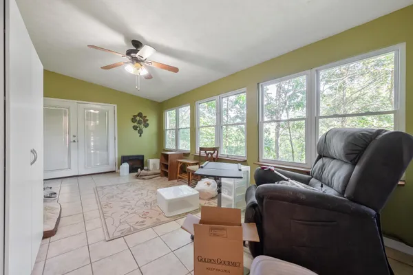 a bedroom with a large bed and a flat screen tv