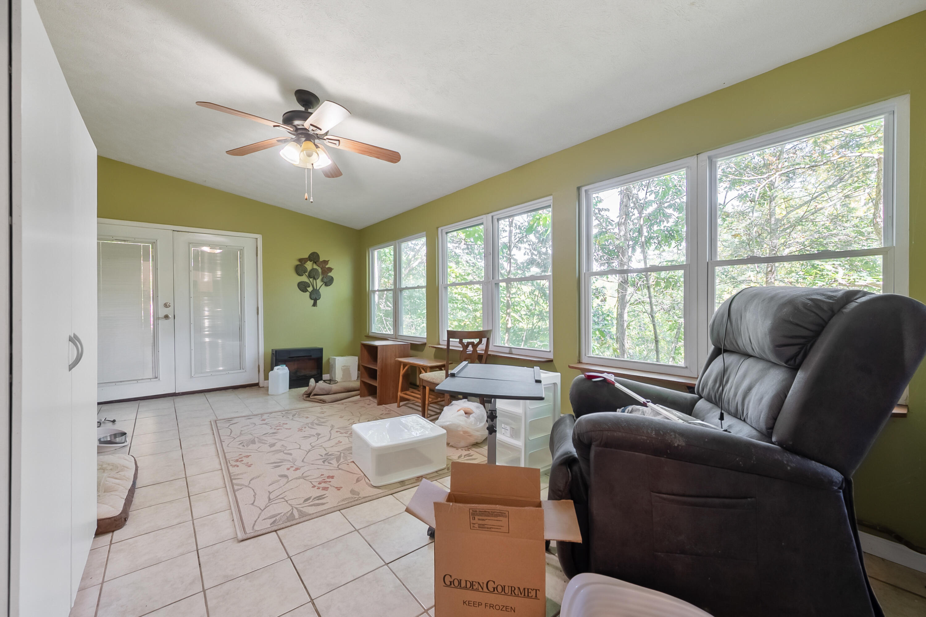 6286 Chestnut Ridge Road Riner, VA 24149 - Photo 21 of 102 a living room with furniture and a large window