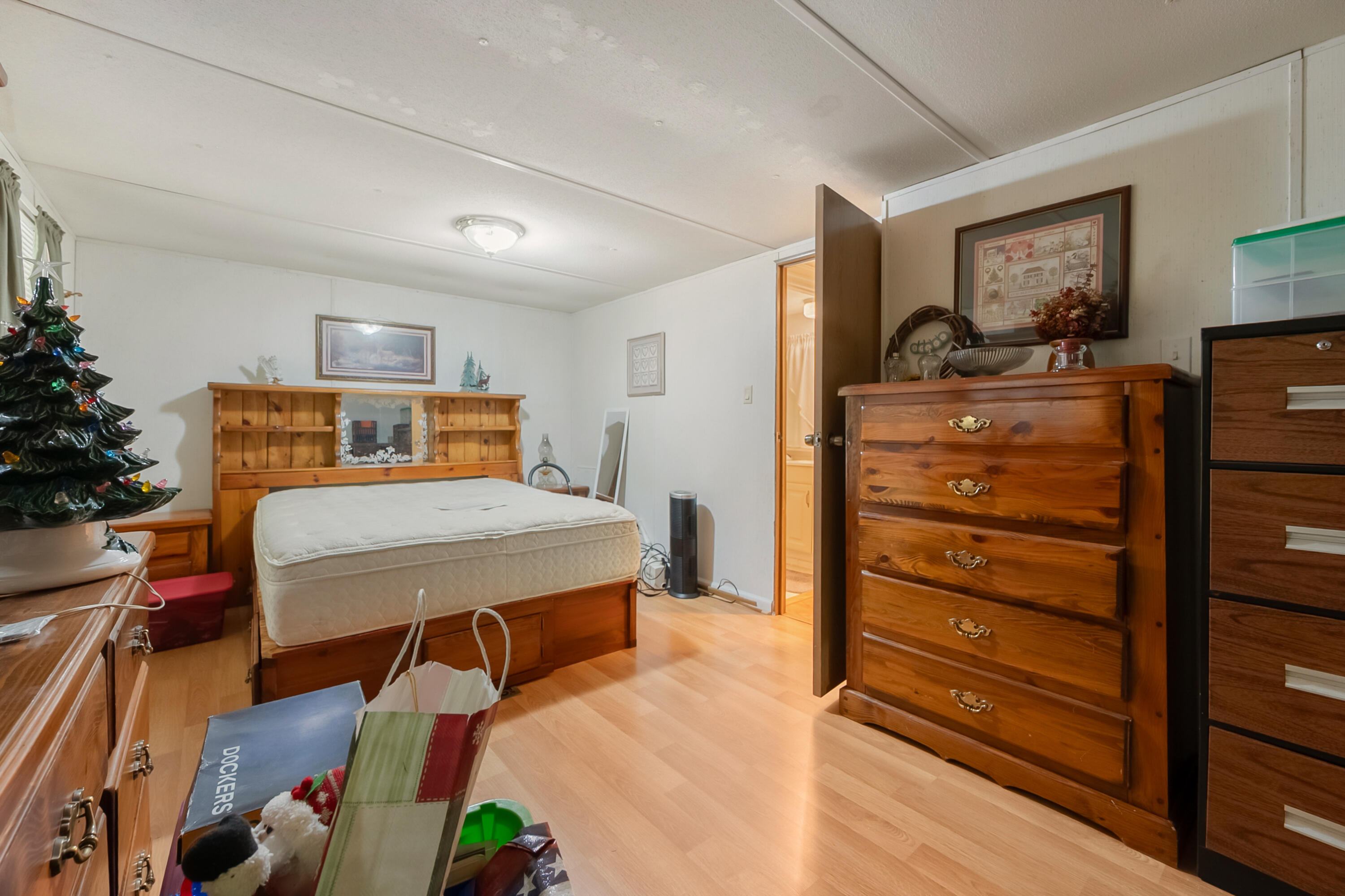 6286 Chestnut Ridge Road Riner, VA 24149 - Photo 37 of 102 a bedroom with a bed and wooden floor