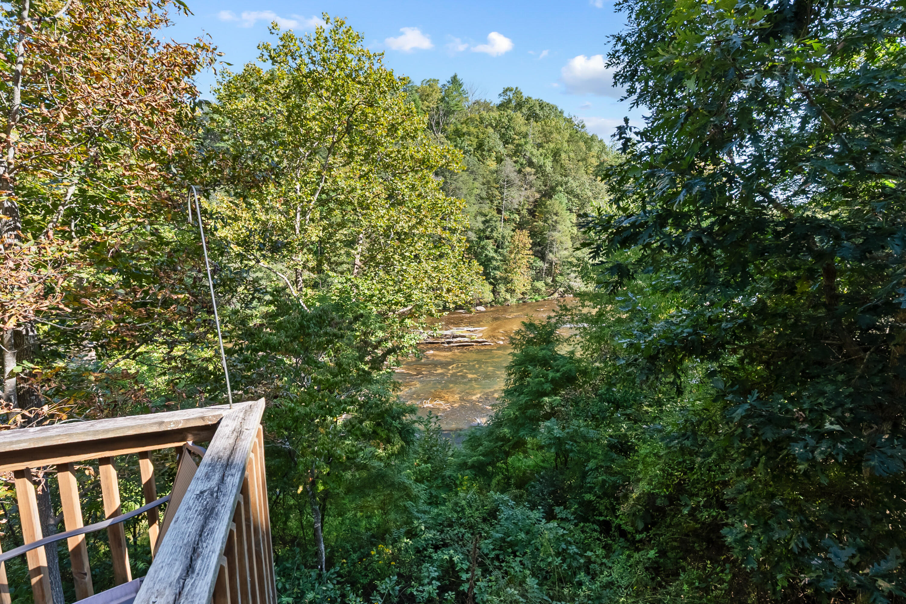 6286 Chestnut Ridge Road Riner, VA 24149 - Photo 40 of 102 a balcony with wooden floor and yard in the back