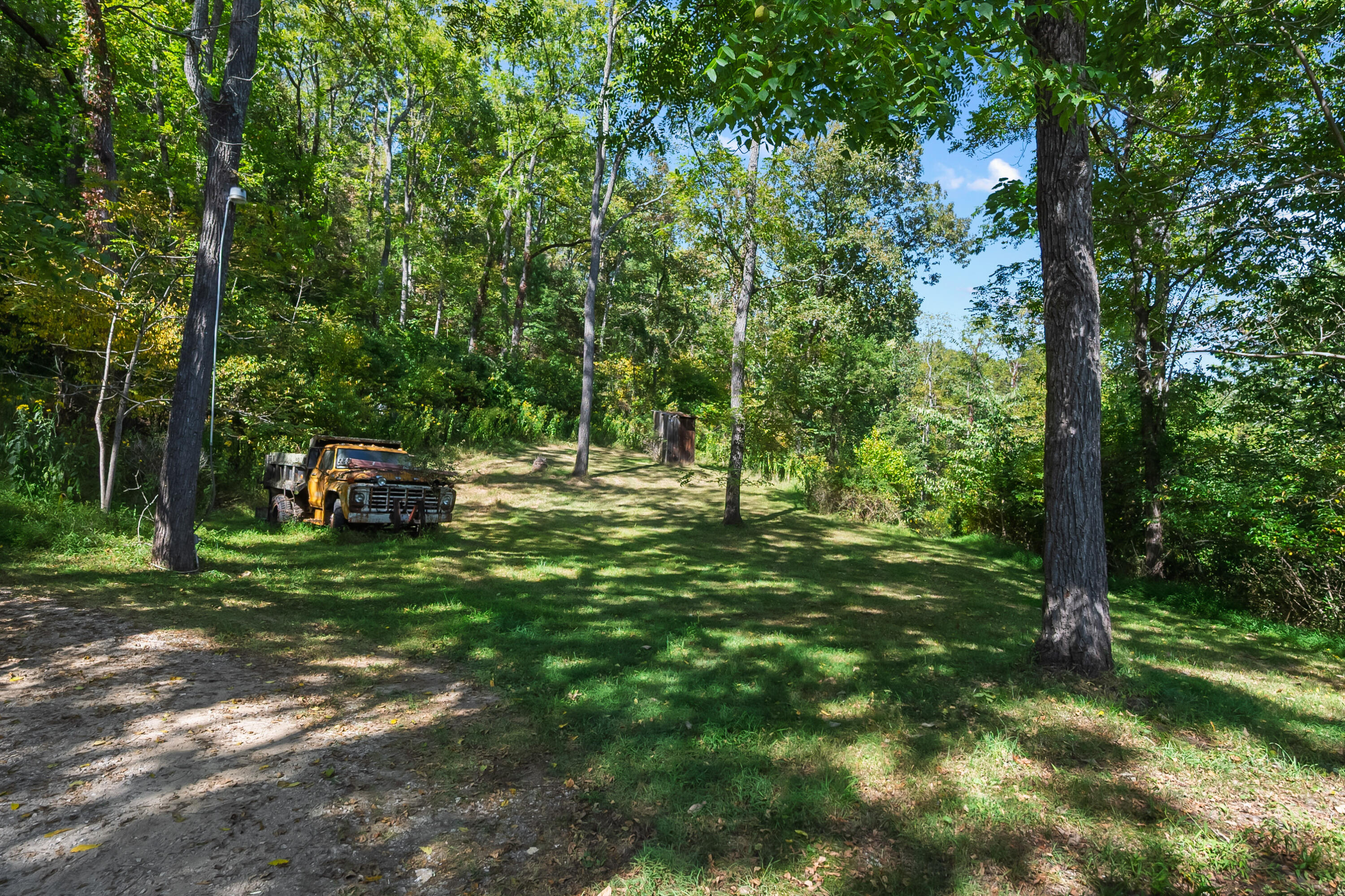6286 Chestnut Ridge Road Riner, VA 24149 - Photo 57 of 102 a backyard of a house with lots of green space