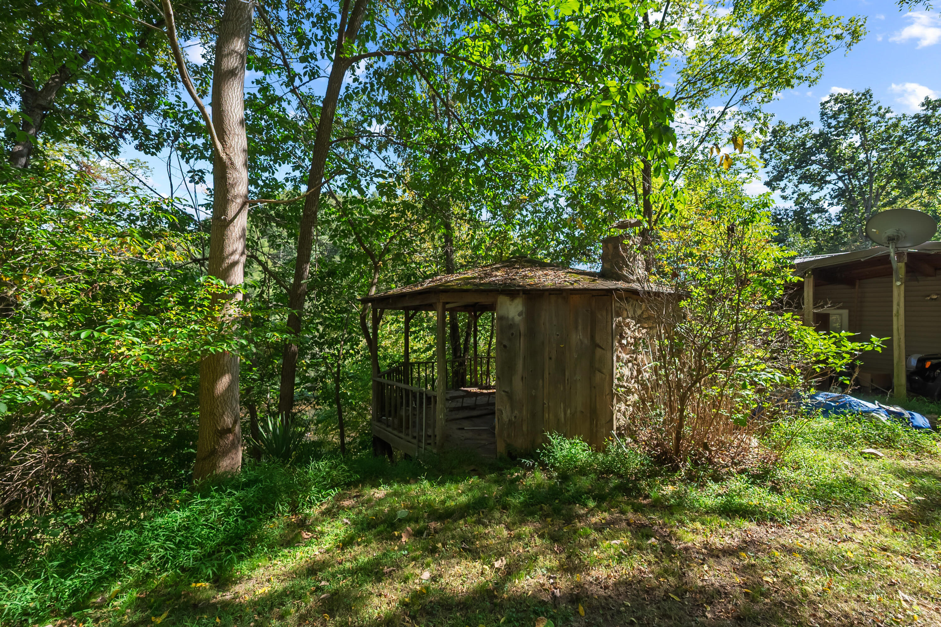 6286 Chestnut Ridge Road Riner, VA 24149 - Photo 58 of 102 a view of a wooden house with a tree