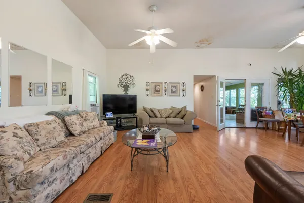 a view of a dining room with furniture and wooden floor
