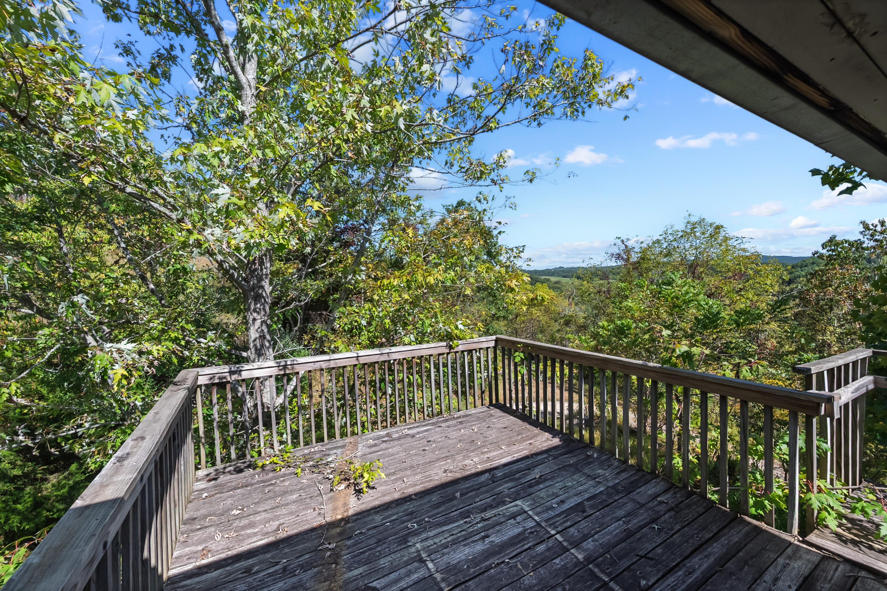 6286 Chestnut Ridge Road Riner, VA 24149 - Photo 93 of 102 a view of balcony with wooden floor and fence