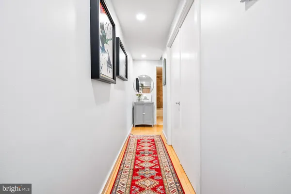 a view of hallway with wooden floor