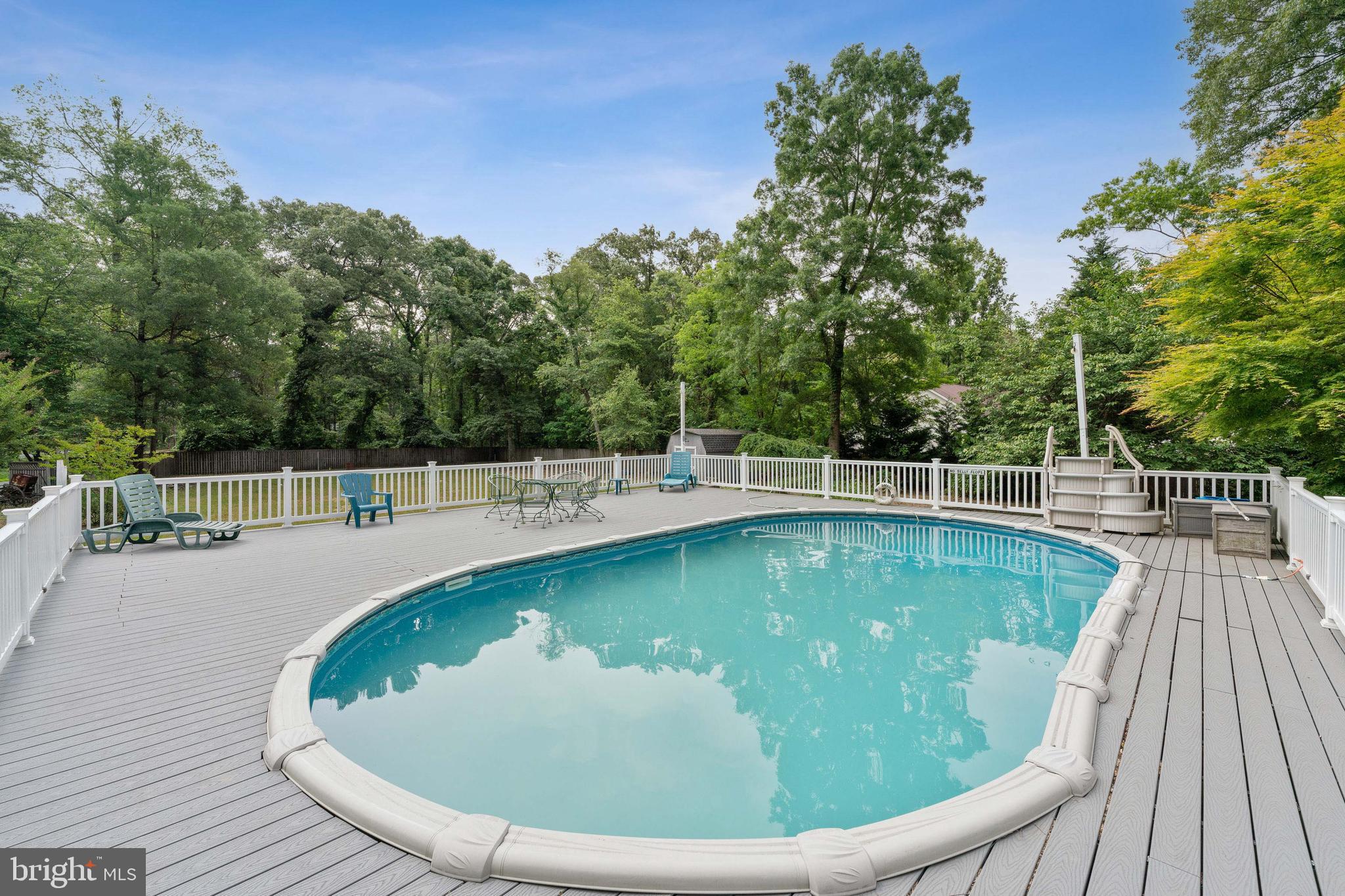 8235 Old Mill Road Pasadena, MD 21122 - Photo 35 of 45 Pool with walk around deck