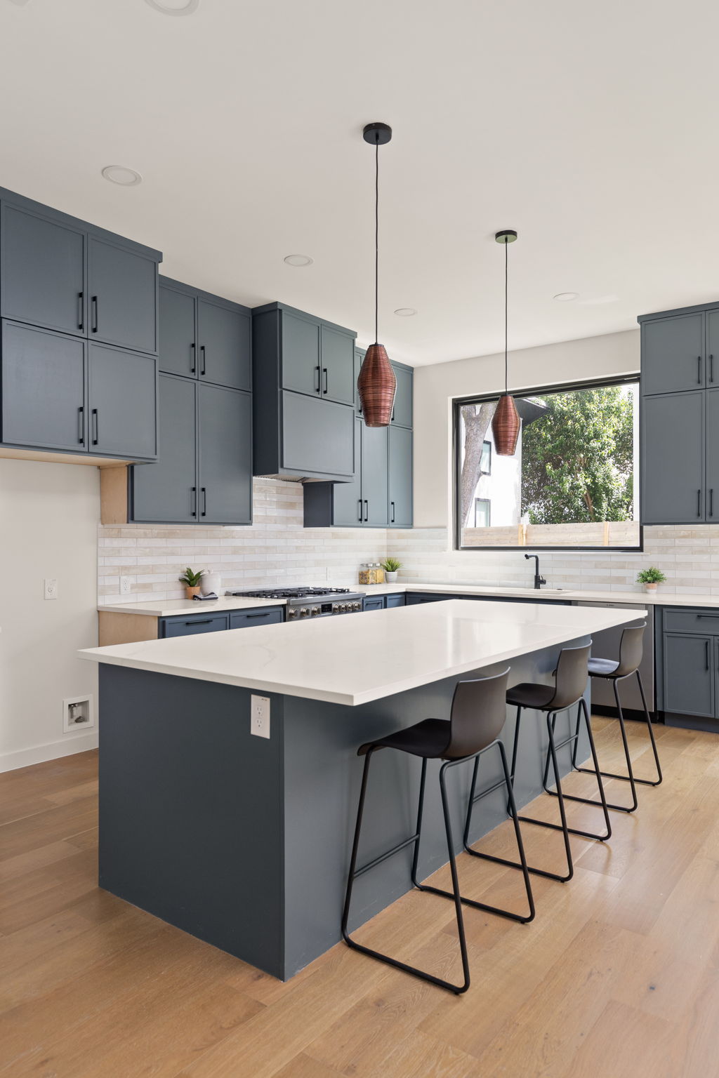 2717 Lyons Road, Unit 1 Austin, TX 78702 - Photo 8 of 40 Culinary dreams come alive in this kitchen featuring abundant cabinetry and a large central island.