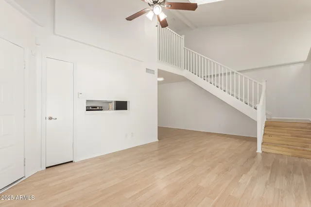 a living room with furniture fireplace and a flat screen tv