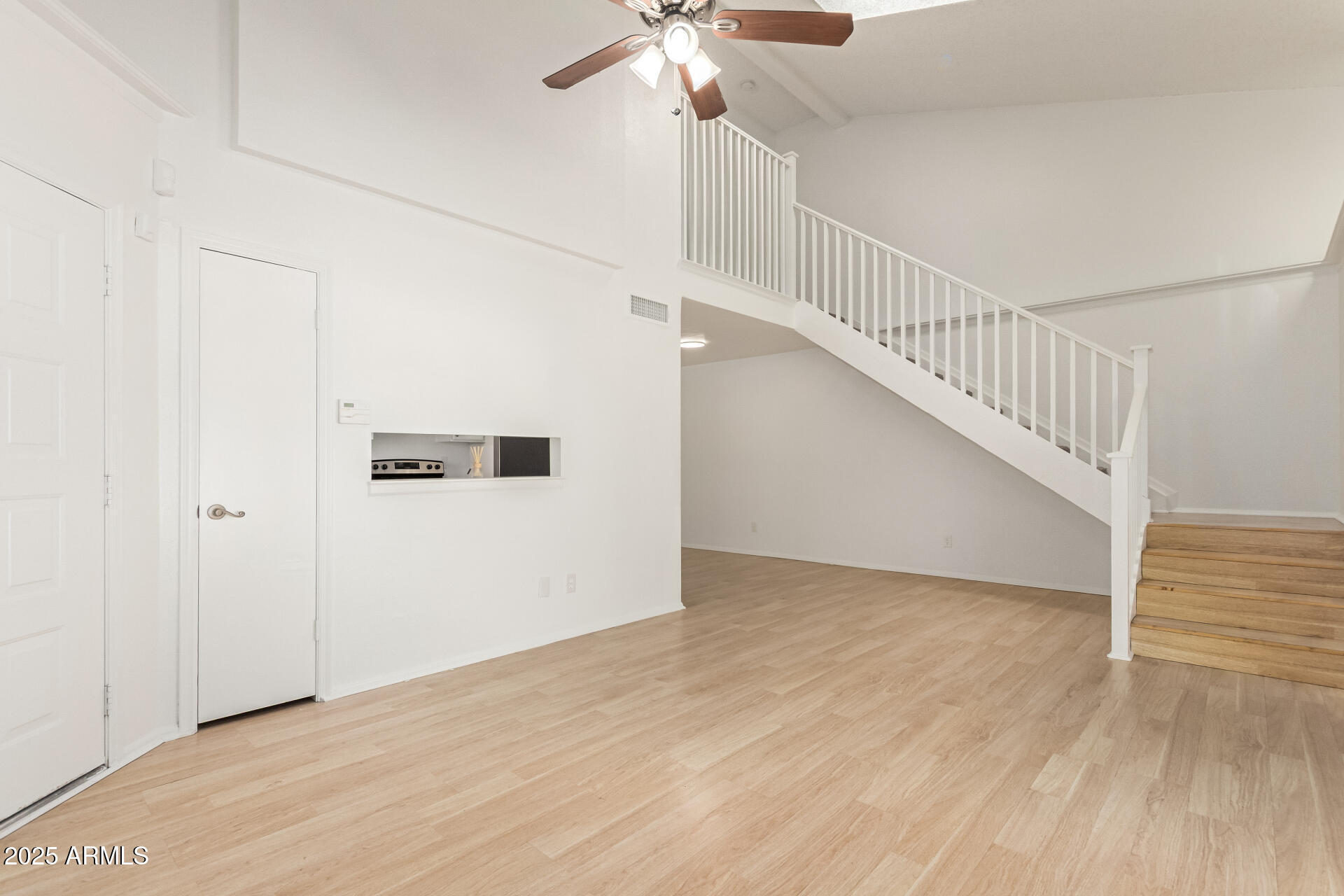 2702 West Brooks Street Chandler, AZ 85224 - Photo 10 of 41 a view of entryway and hall with wooden floor
