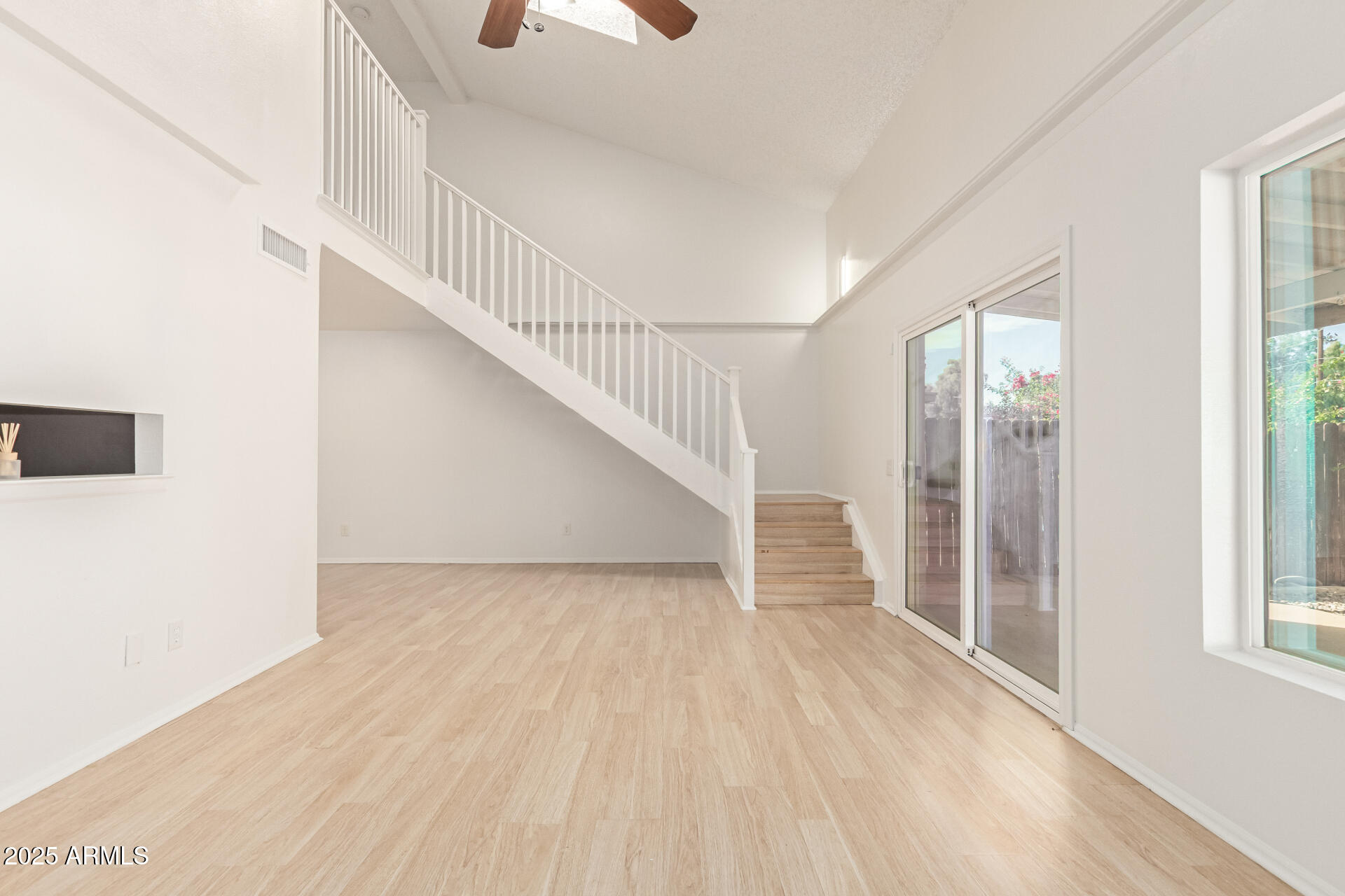 2702 West Brooks Street Chandler, AZ 85224 - Photo 11 of 41 a view of entryway and hall with wooden floor