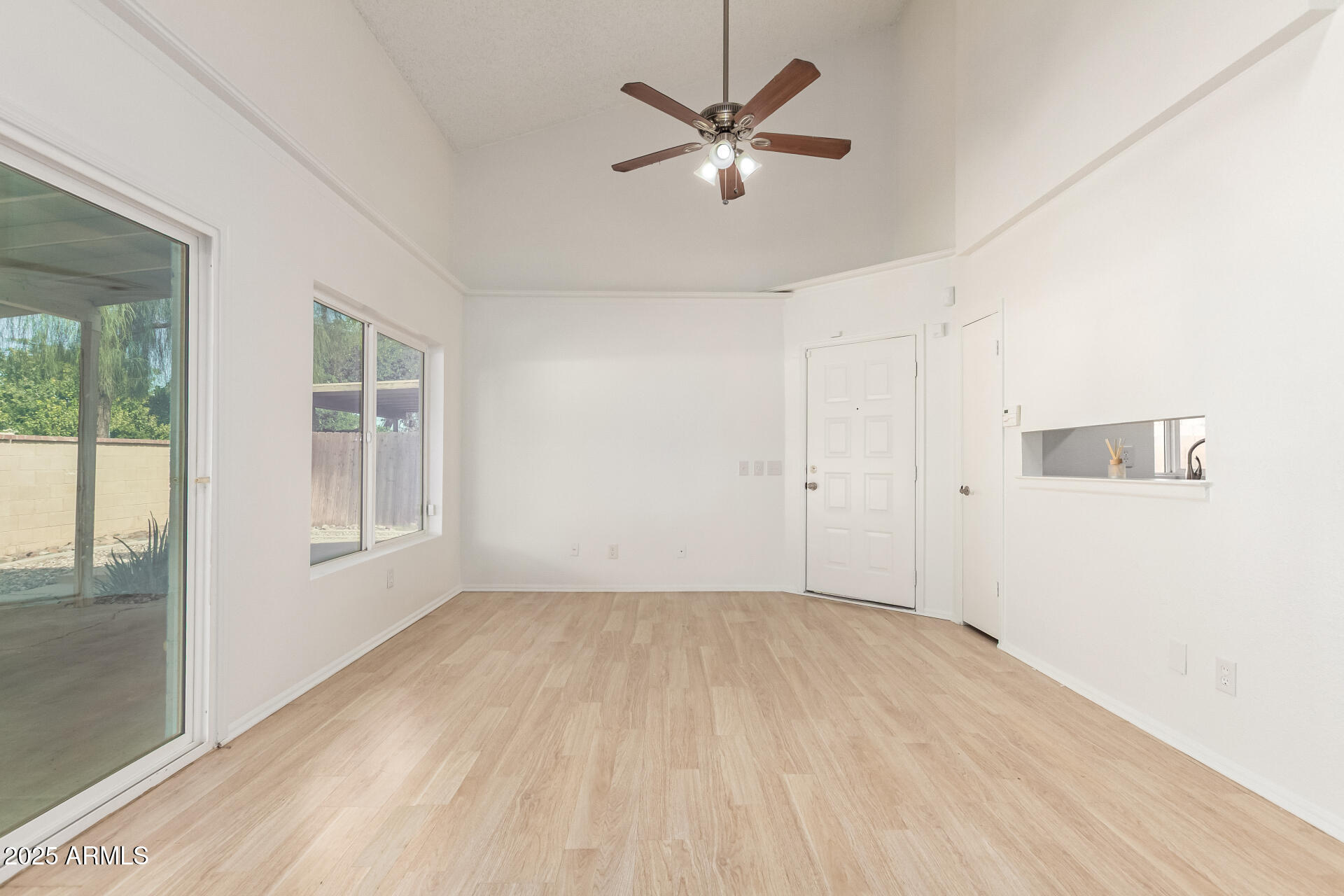 2702 West Brooks Street Chandler, AZ 85224 - Photo 13 of 41 wooden floor in an empty room with a window