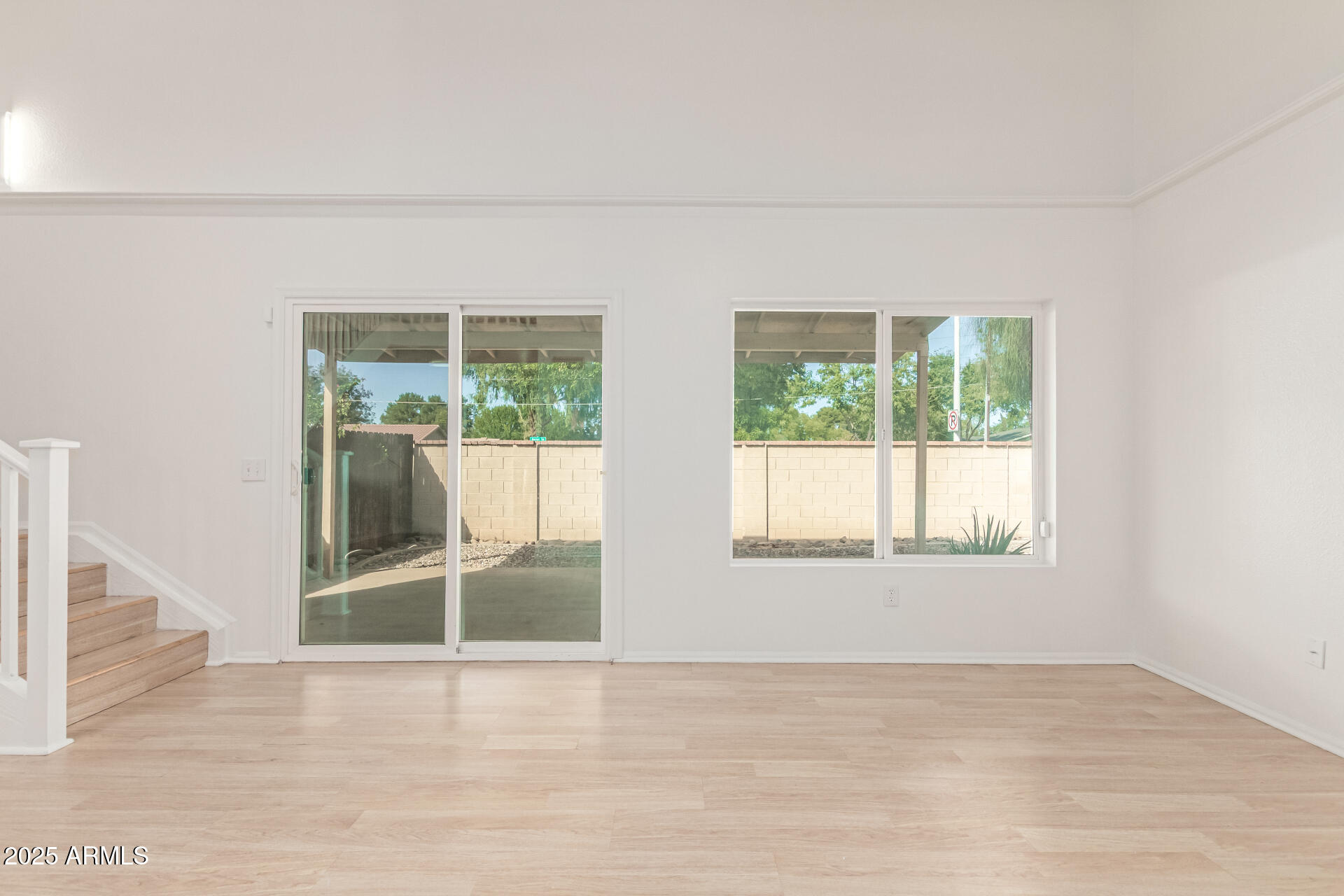 2702 West Brooks Street Chandler, AZ 85224 - Photo 14 of 41 an empty room with wooden floor and windows