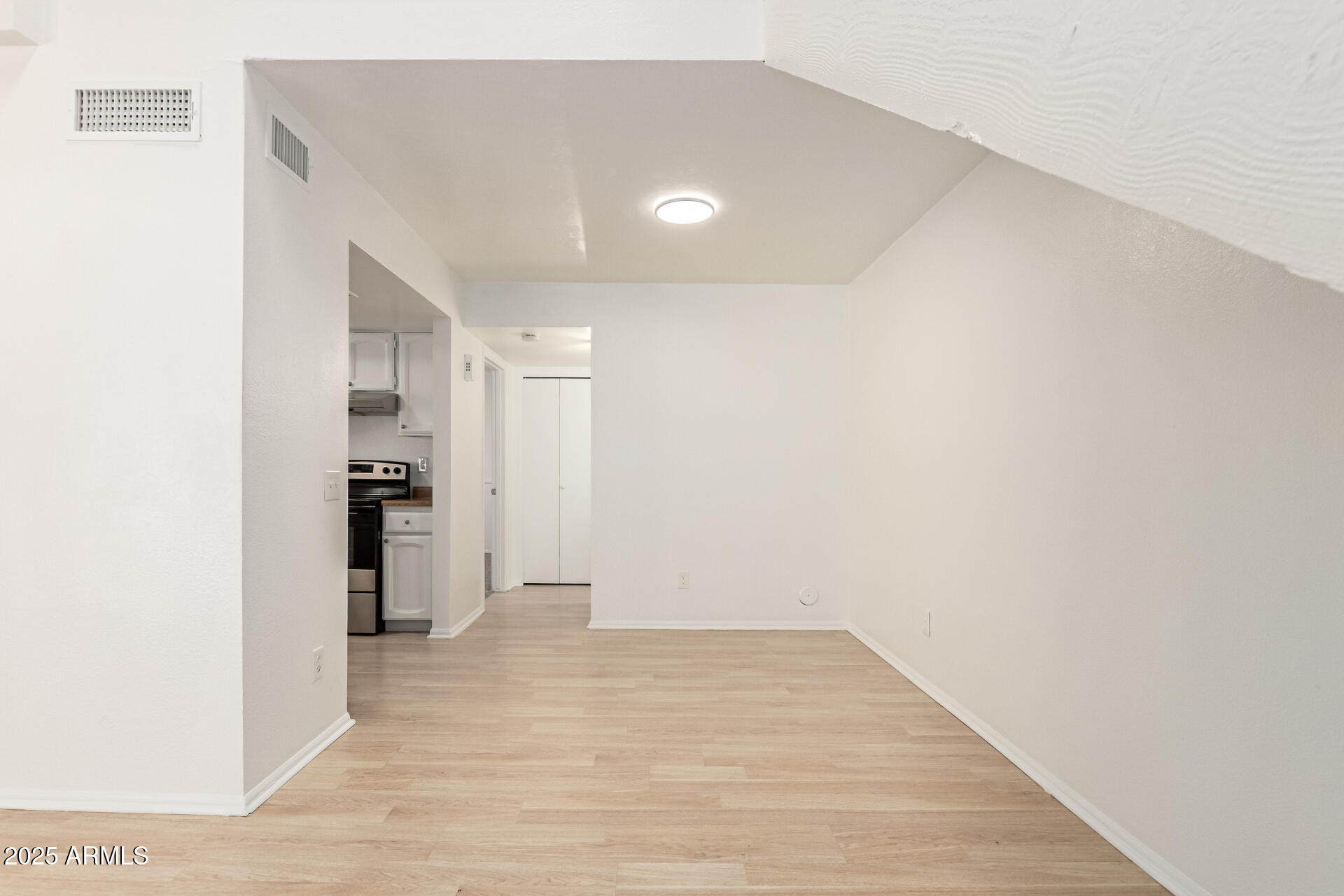2702 West Brooks Street Chandler, AZ 85224 - Photo 16 of 41 a view of empty room with wooden floor