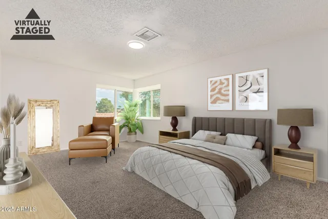 a bedroom with a bed and a couch