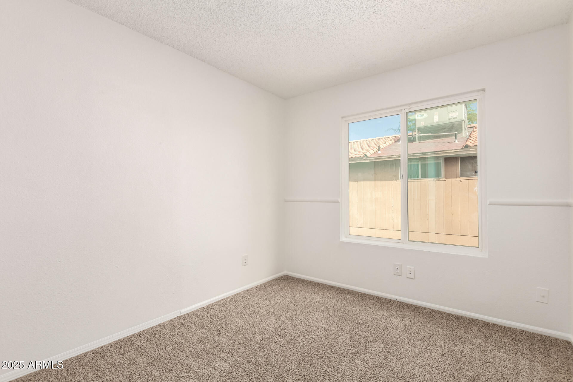 2702 West Brooks Street Chandler, AZ 85224 - Photo 31 of 41 an empty room with a window