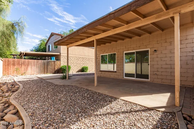a view of a backyard with a patio