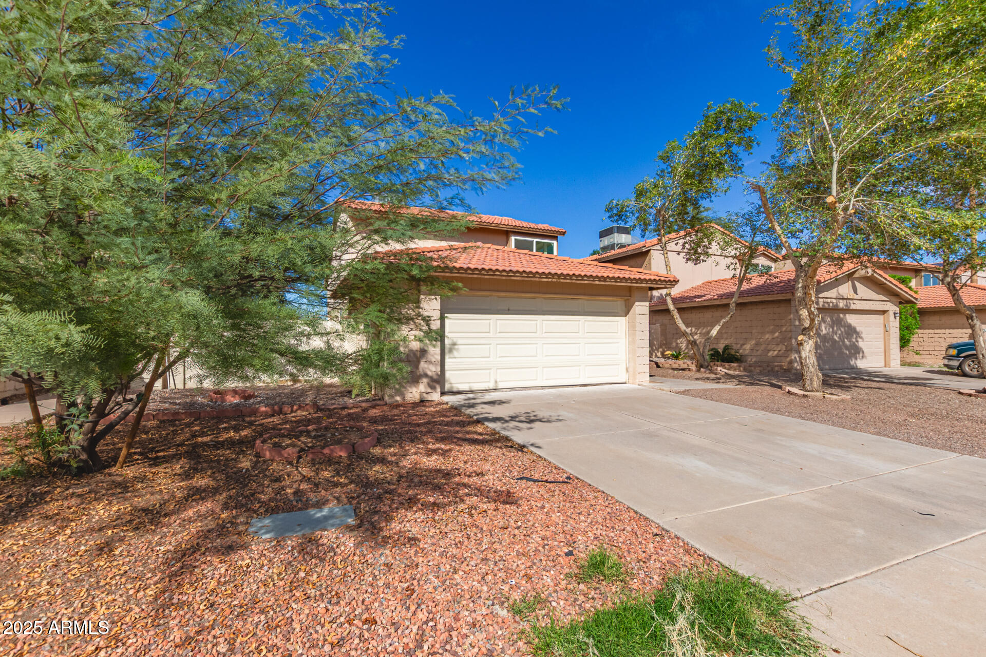 2702 West Brooks Street Chandler, AZ 85224 - Photo 3 of 41 a view of a house with a yard and garage