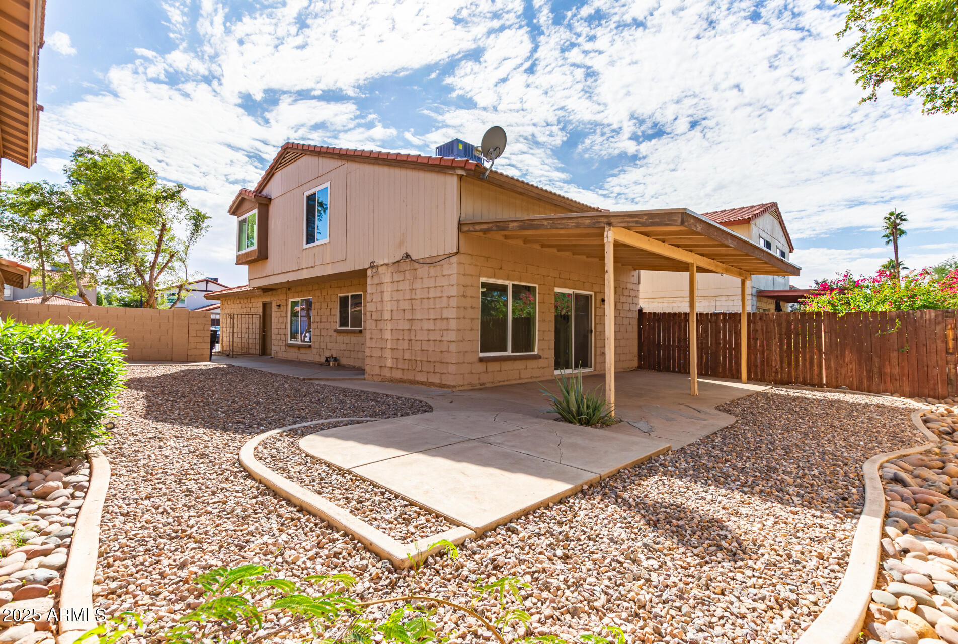2702 West Brooks Street Chandler, AZ 85224 - Photo 40 of 41 a view of a white house with a yard
