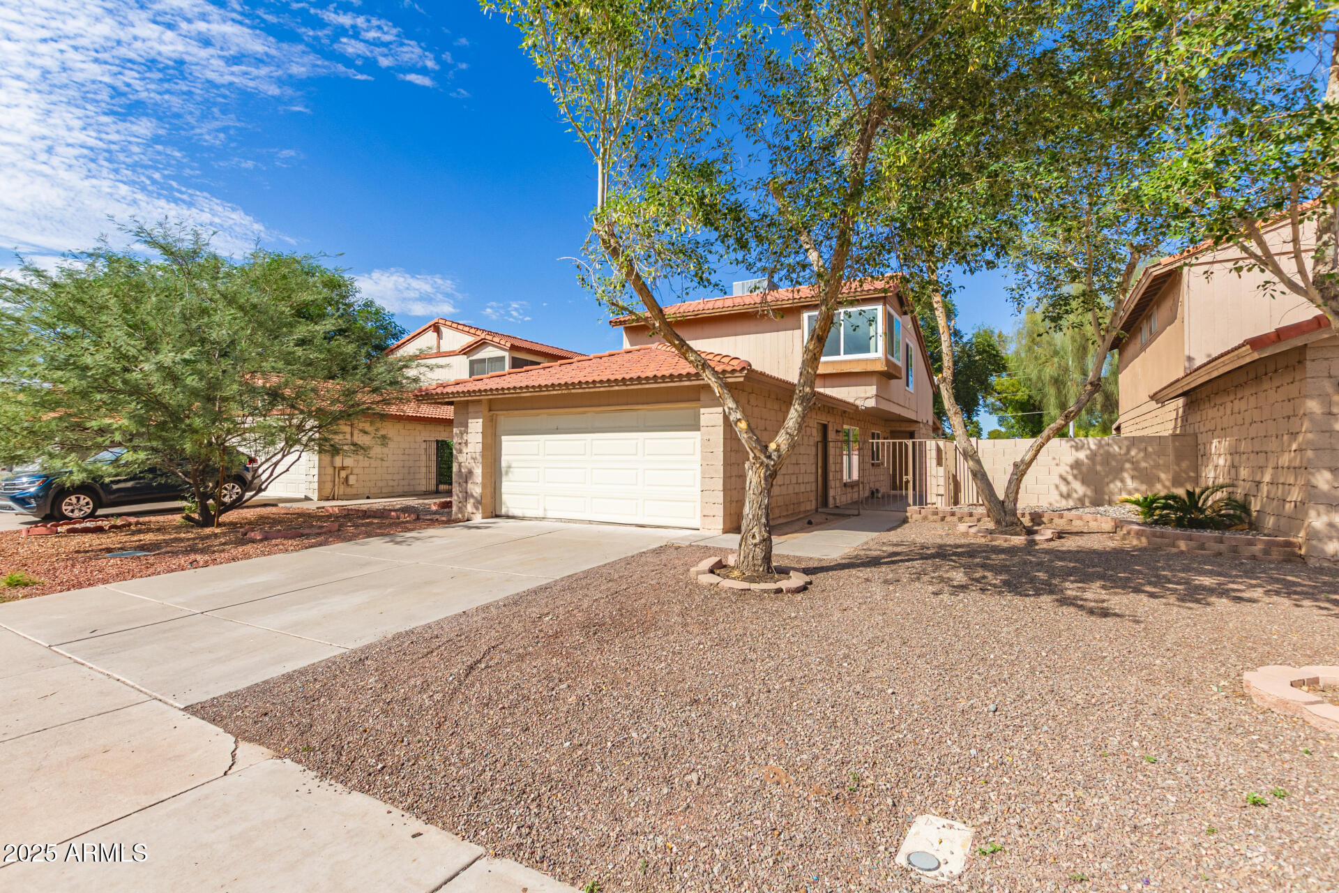 2702 West Brooks Street Chandler, AZ 85224 - Photo 5 of 41 a front view of a house with a yard and garage