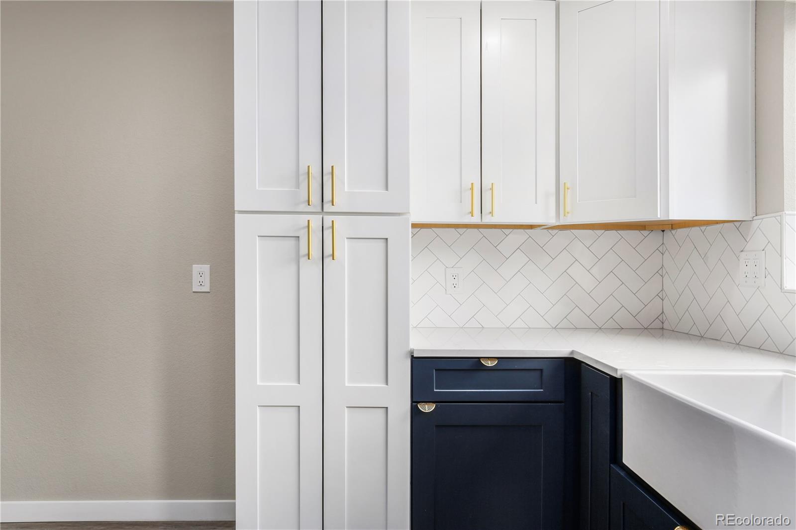 4334 North Decatur Street Denver, CO 80211 - Photo 20 of 26 a kitchen with a white cabinets and a sink