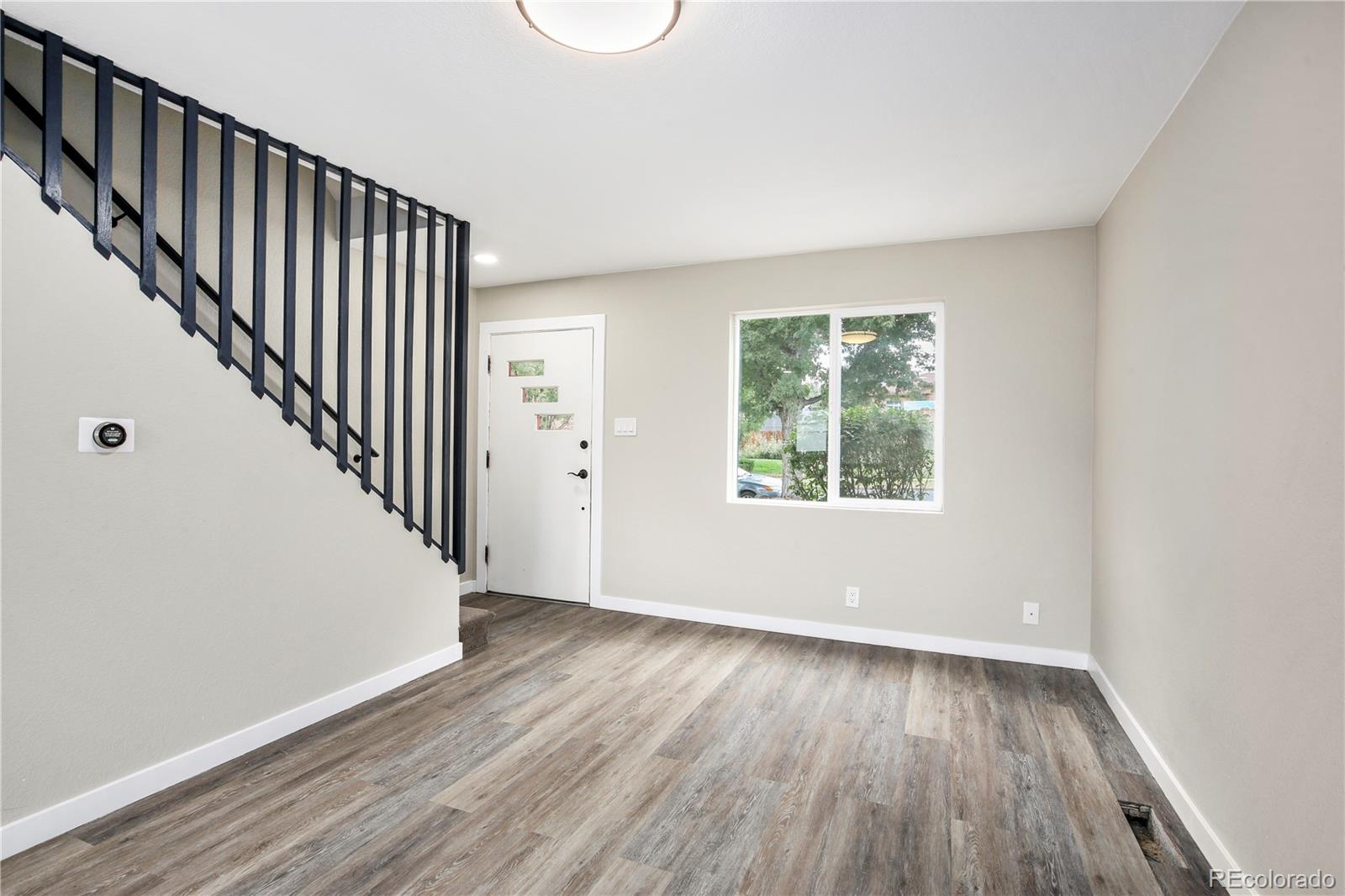 4334 North Decatur Street Denver, CO 80211 - Photo 25 of 26 wooden floor in an empty room with a window