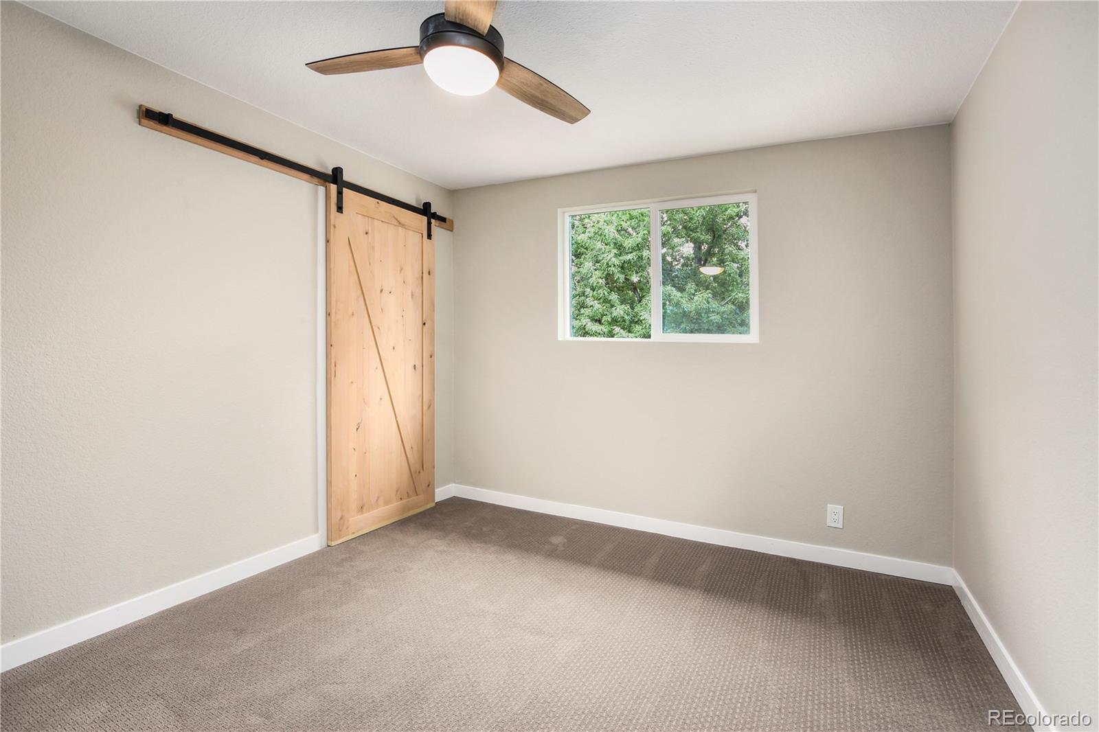 4334 North Decatur Street Denver, CO 80211 - Photo 6 of 26 a view of an empty room with a window