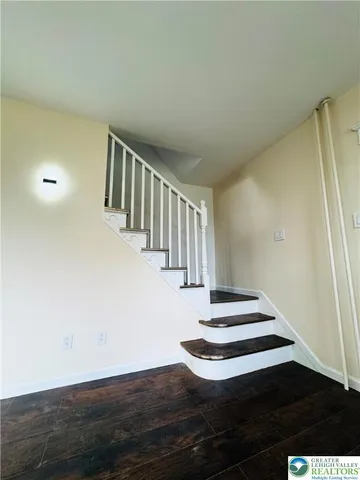 a view of entryway with wooden floor