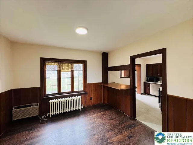 a bedroom with furniture and window
