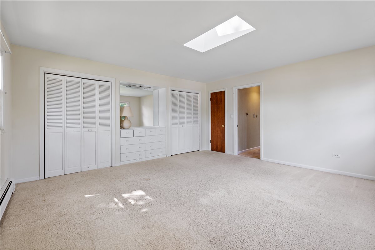 117 Beverly Road Barrington, IL 60010 - Photo 15 of 28 a view of an empty room with chandelier fan