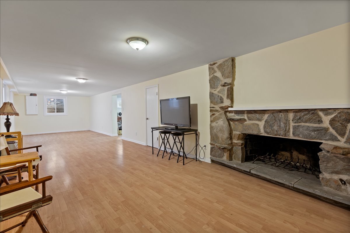 117 Beverly Road Barrington, IL 60010 - Photo 21 of 28 a living room with furniture a flat screen tv and a fireplace