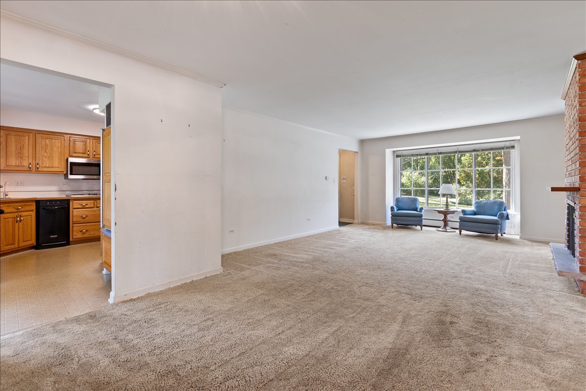 117 Beverly Road Barrington, IL 60010 - Photo 3 of 28 an empty room with furniture and a fireplace