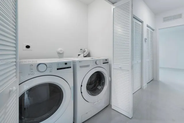 a utility room with dryer and washer
