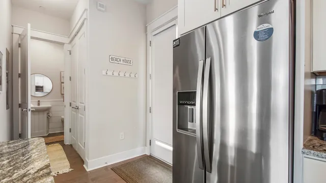a view of a bathroom with a sink and mirror