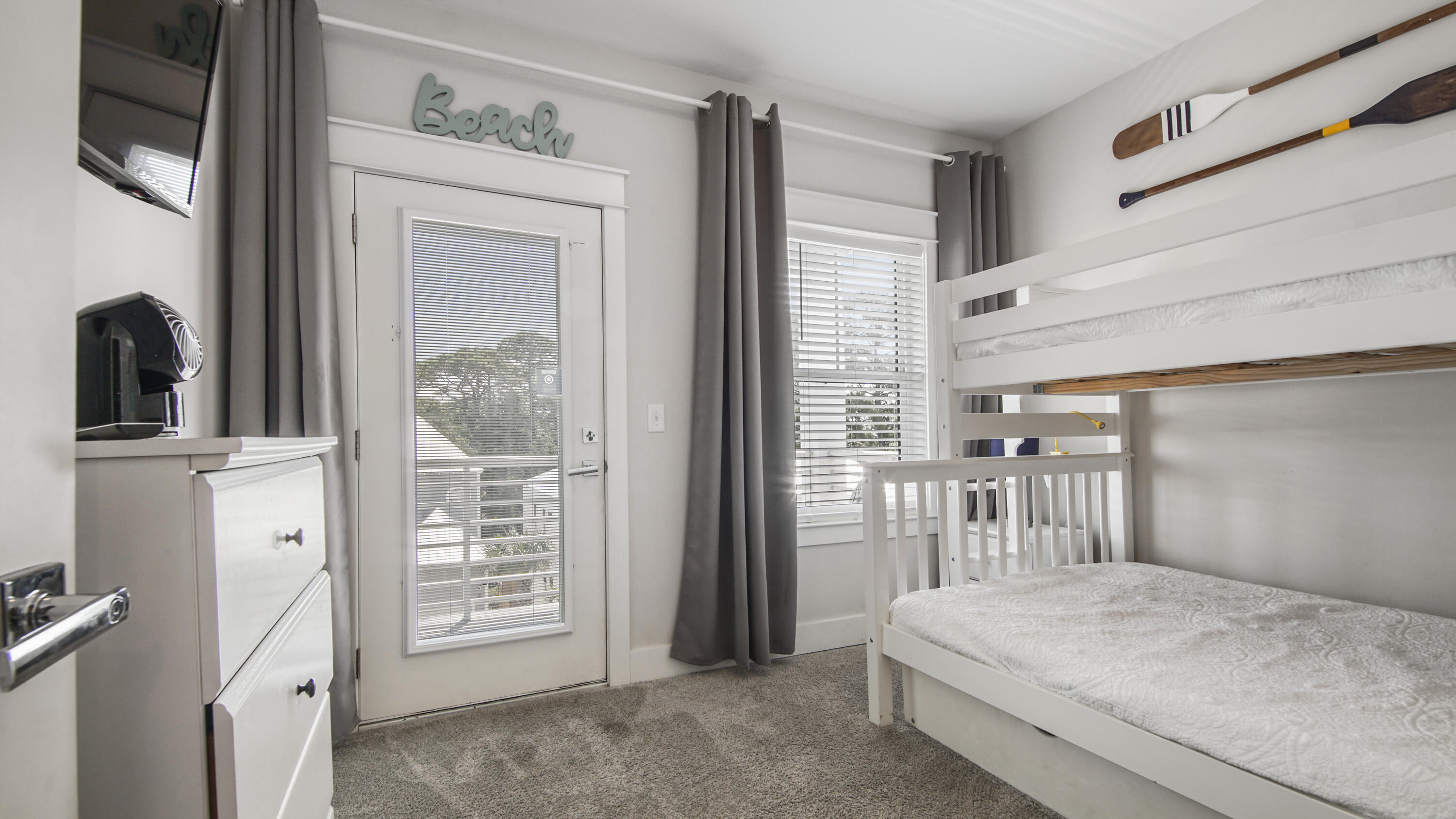 61 Charming Way Santa Rosa Beach, FL 32459 - Photo 20 of 41 a bedroom with a bed next to a window with the outer view