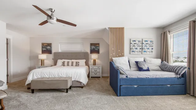 a spacious bedroom with a bed and a couch