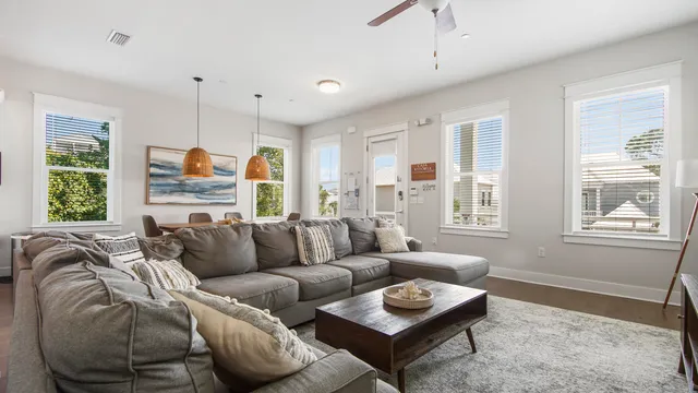 a living room with furniture fireplace and window