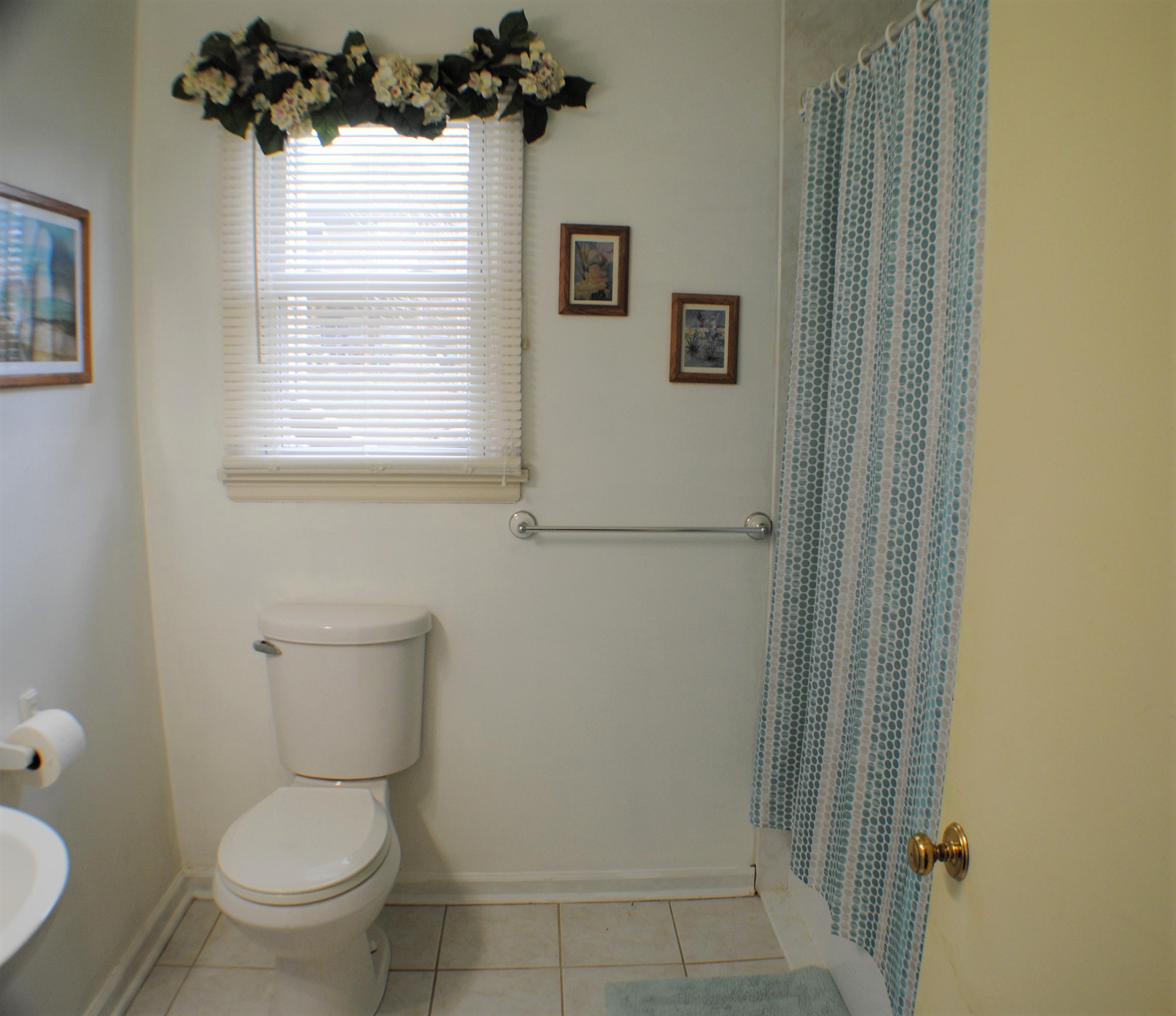 5229 Cave Spring Lane Roanoke, VA 24018 - Photo 17 of 49 a white toilet sitting next to a bathroom sink