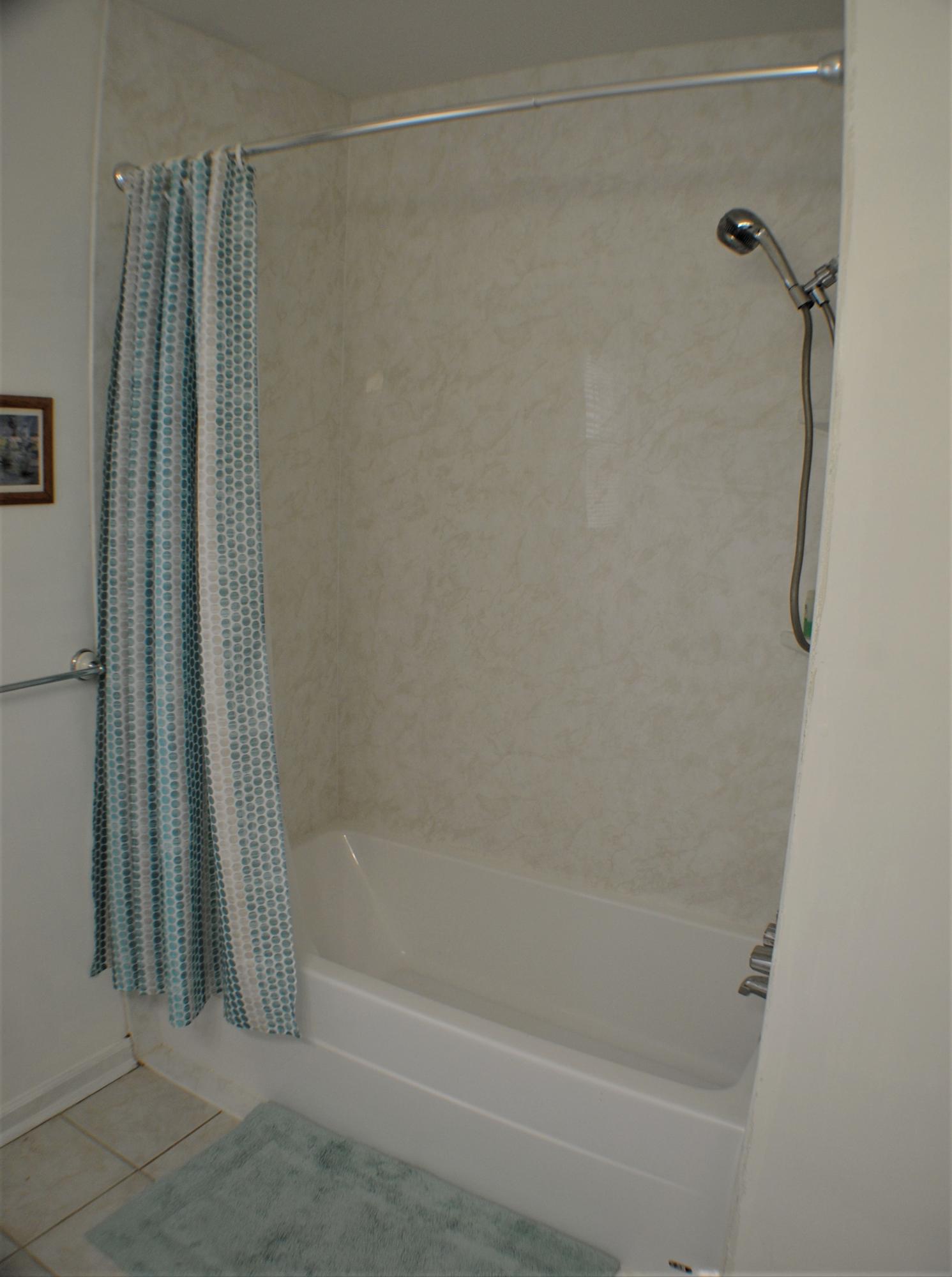 5229 Cave Spring Lane Roanoke, VA 24018 - Photo 18 of 49 a bathroom with a shower and a bath tub