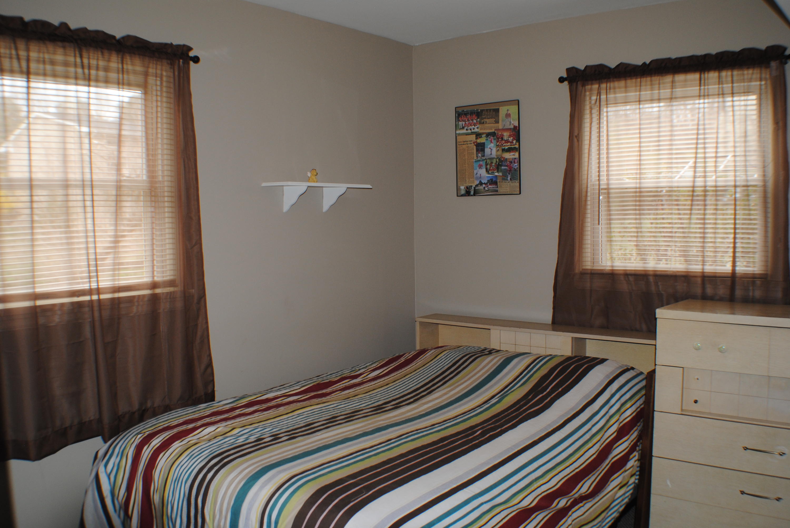 5229 Cave Spring Lane Roanoke, VA 24018 - Photo 20 of 49 a bedroom with a bed and a window