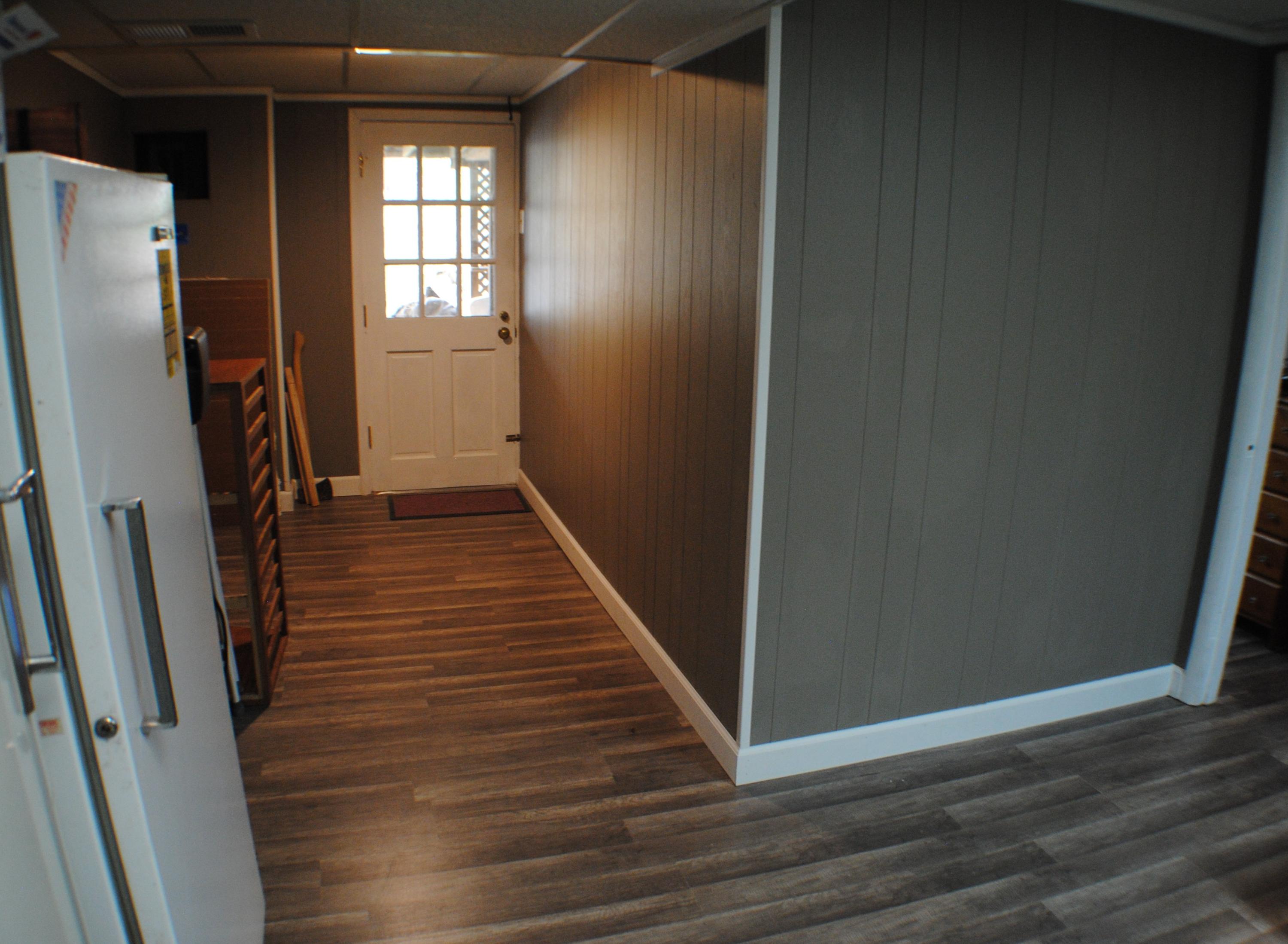 5229 Cave Spring Lane Roanoke, VA 24018 - Photo 23 of 49 a view of a hallway with wooden floor and staircase