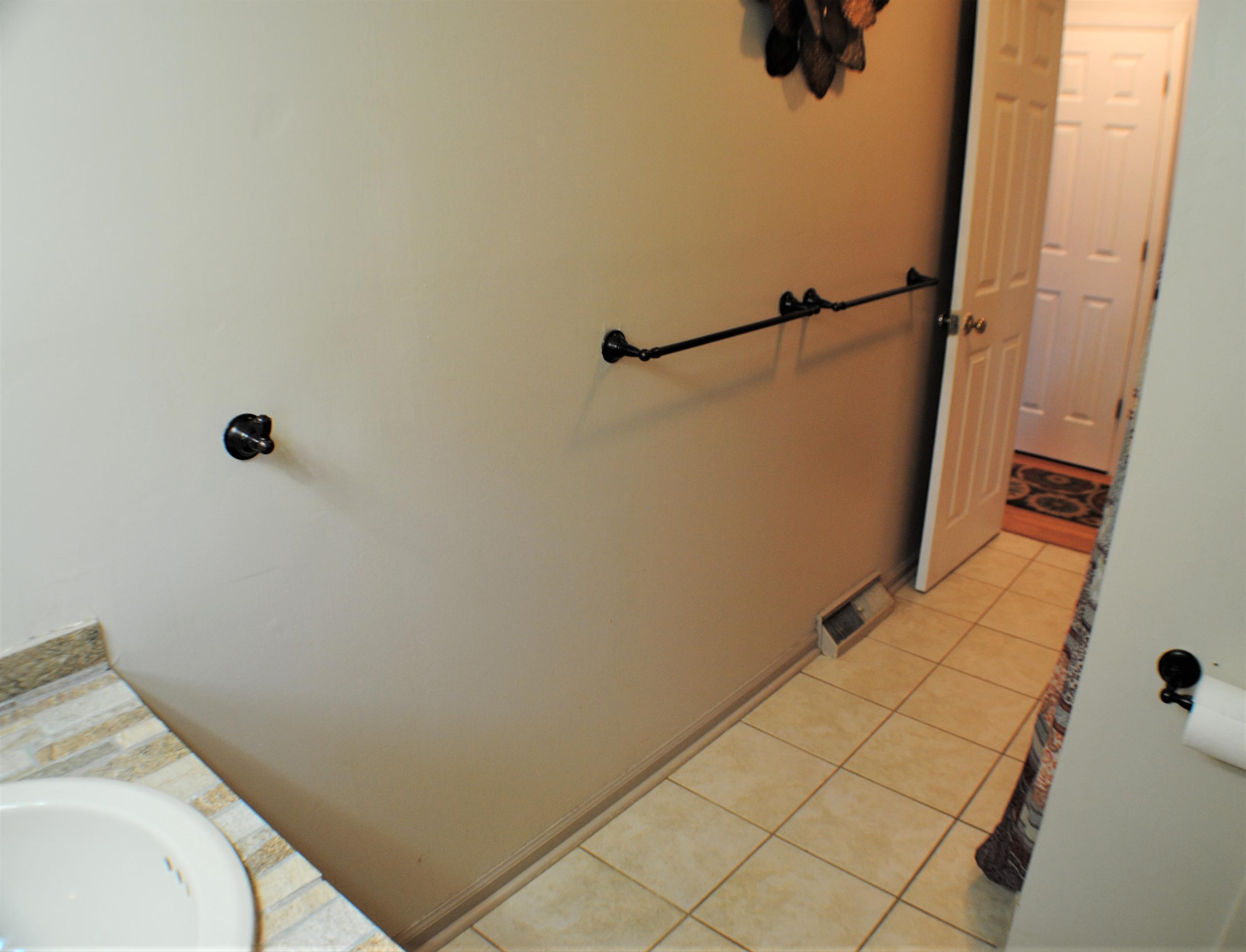 5229 Cave Spring Lane Roanoke, VA 24018 - Photo 26 of 49 a bathroom with a sink and shower